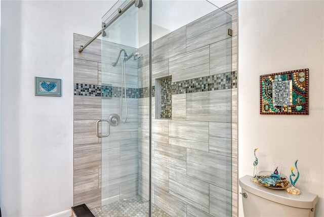 7806 Ontario Street Cir Unit 7806, Sarasota, FL 34243 - bathroom featuring toilet and a shower stall