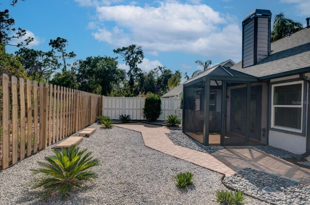 7806 Ontario Street Cir Unit 7806, Sarasota, FL 34243 - fenced backyard with a sunroom and a patio