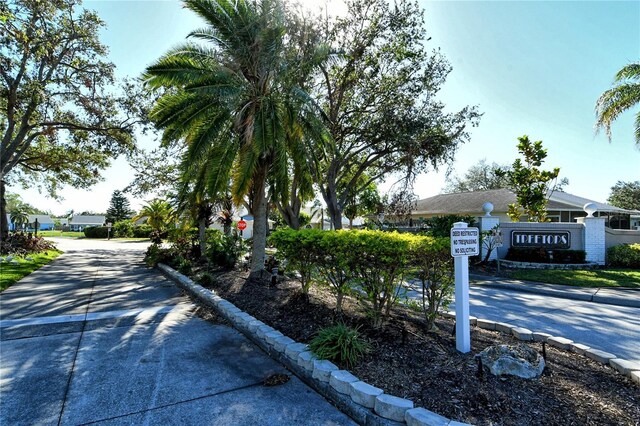 7806 Ontario Street Cir Unit 7806, Sarasota, FL 34243 - view of concrete road featuring traffic signs