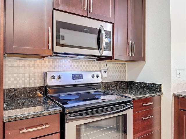 kitchen featuring dark stone countertops, stainless steel appliances, and tasteful backsplash