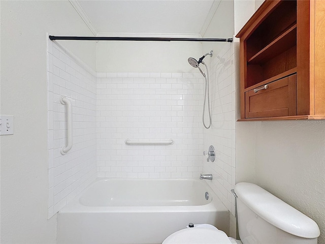 bathroom with crown molding, tiled shower / bath, and toilet