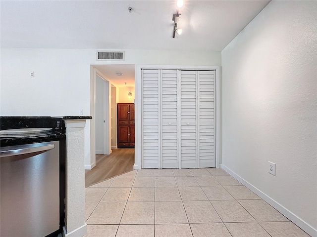 kitchen with dishwasher and light tile patterned floors