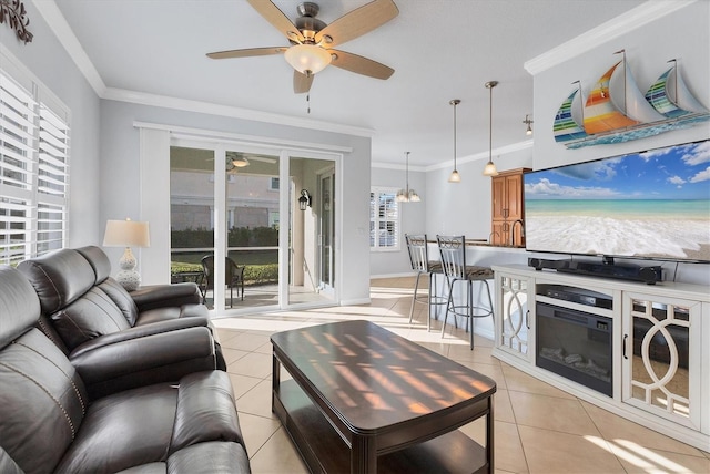 tiled living room featuring an inviting chandelier and crown molding