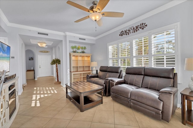 living room featuring ceiling fan, light tile patterned floors, and crown molding