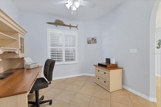 500 San Lino Cir Unit 511, Venice, FL 34292 - office area featuring ceiling fan, light tile patterned floors, arched walkways, and baseboards