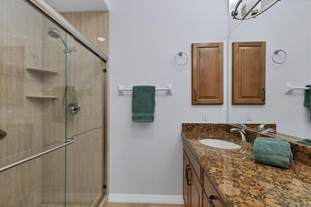 bathroom with vanity and an enclosed shower