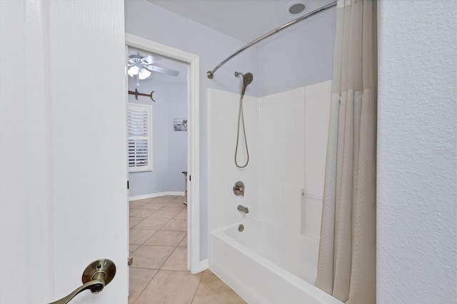 bathroom with tile patterned floors, ceiling fan, and shower / tub combo with curtain