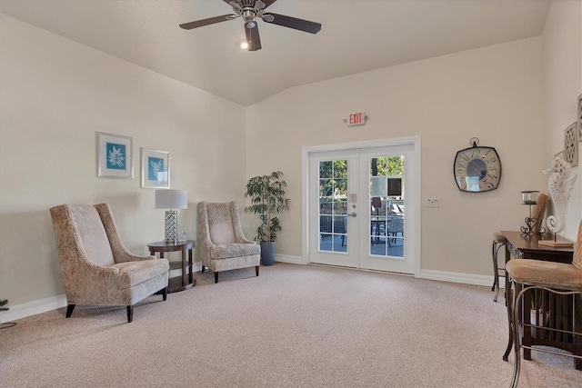 sitting room with ceiling fan, lofted ceiling, light carpet, and french doors