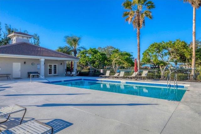 view of pool with a patio and french doors