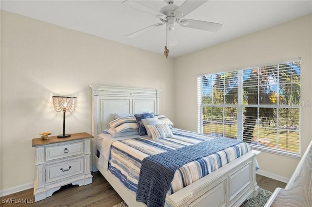 bedroom featuring ceiling fan and dark wood-type flooring