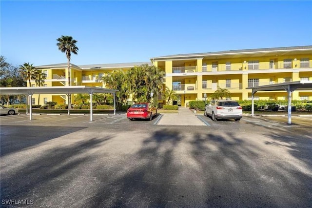 2060 Willow Hammock Cir Unit 304, Punta Gorda, FL 33983 - view of property featuring covered and uncovered parking