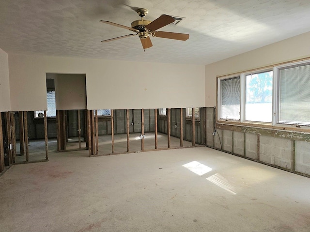 unfurnished room with ceiling fan