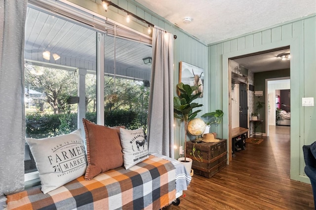 interior space featuring dark hardwood / wood-style floors and crown molding