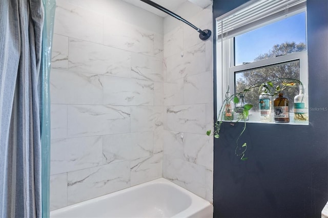 bathroom with shower / bath combination with curtain