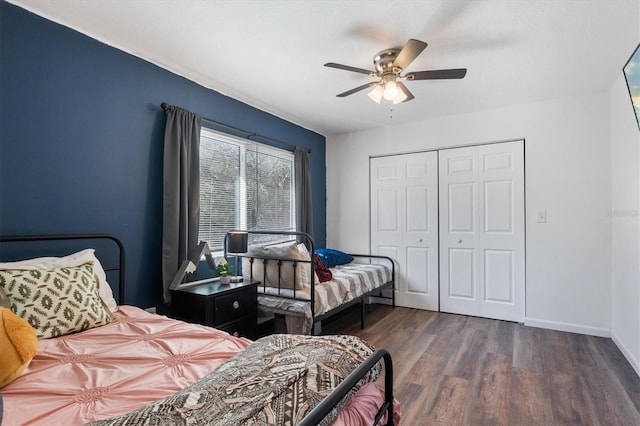 bedroom featuring ceiling fan, dark wood-type flooring, and a closet