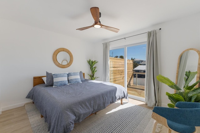 bedroom with light hardwood / wood-style flooring and ceiling fan