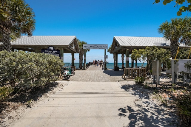 view of dock featuring a gazebo and a water view