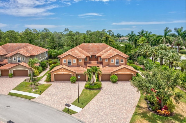 mediterranean / spanish-style home featuring a garage