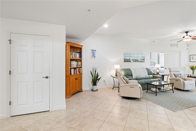 living room featuring ceiling fan and light tile patterned flooring