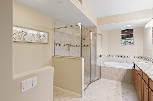 bathroom featuring vanity, tile patterned floors, and independent shower and bath