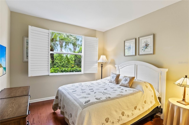 bedroom featuring dark hardwood / wood-style flooring