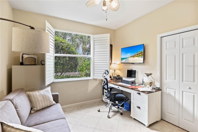 home office with light tile patterned floors and ceiling fan