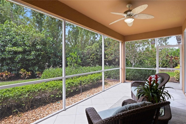 sunroom / solarium featuring ceiling fan