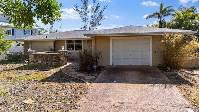 ranch-style home with a garage