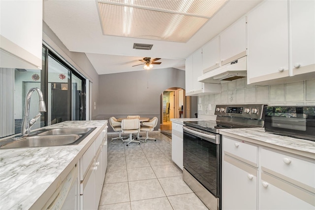 kitchen with stainless steel range with electric stovetop, vaulted ceiling, ceiling fan, sink, and white cabinets