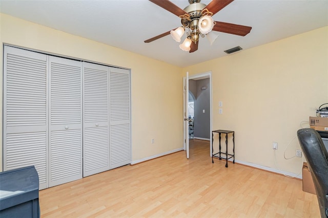 office space with light hardwood / wood-style flooring and ceiling fan