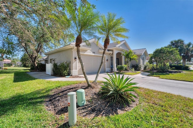 single story home featuring a front lawn and a garage