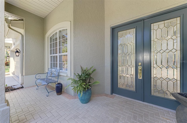 property entrance featuring french doors