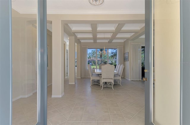 unfurnished dining area featuring coffered ceiling, crown molding, light tile patterned floors, an inviting chandelier, and beamed ceiling