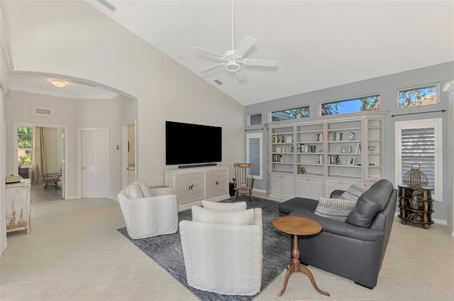 tiled living room featuring high vaulted ceiling, ceiling fan, and crown molding