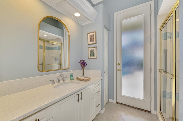 full bathroom with tile patterned flooring, a shower stall, and vanity