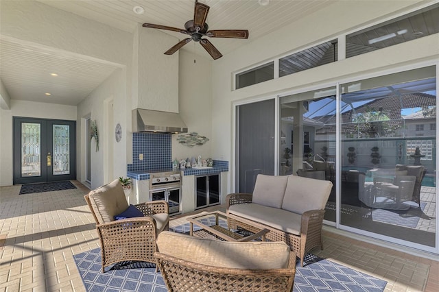 view of patio featuring ceiling fan, an outdoor hangout area, and french doors