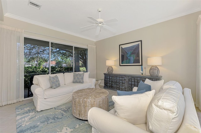 living area with ceiling fan, ornamental molding, tile patterned flooring, and visible vents