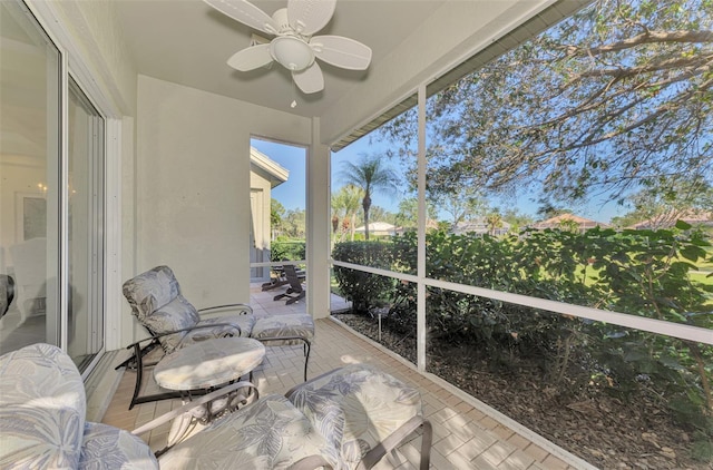 sunroom / solarium with ceiling fan