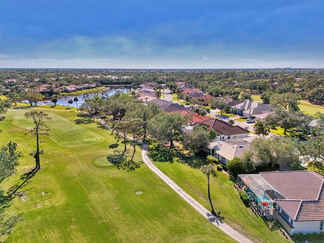 bird's eye view with view of golf course, a water view, and a residential view