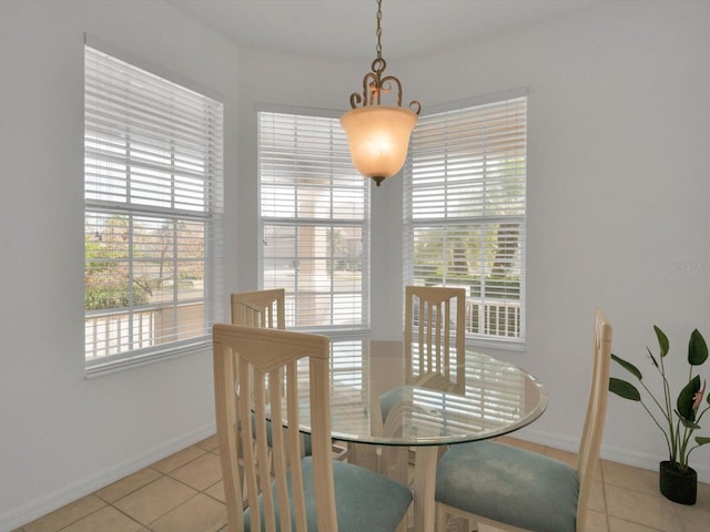 dining space featuring a wealth of natural light and light tile patterned floors