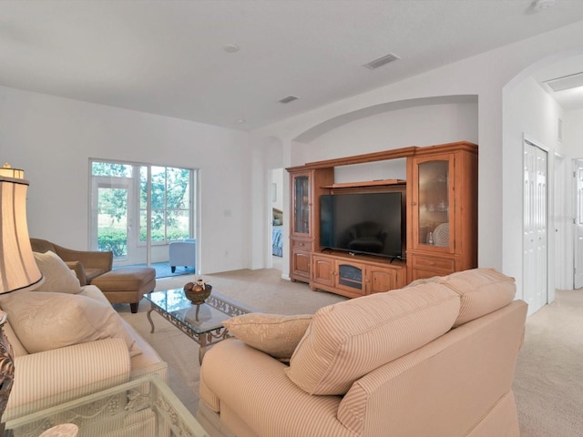 living room featuring light carpet