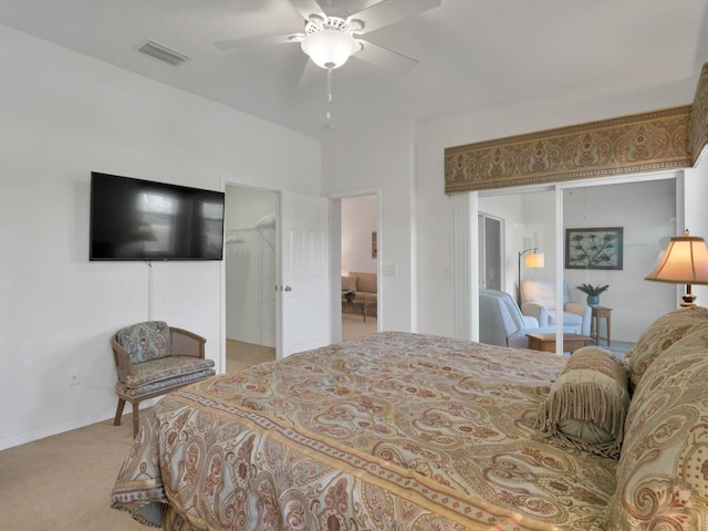 bedroom with ceiling fan, a closet, and light colored carpet