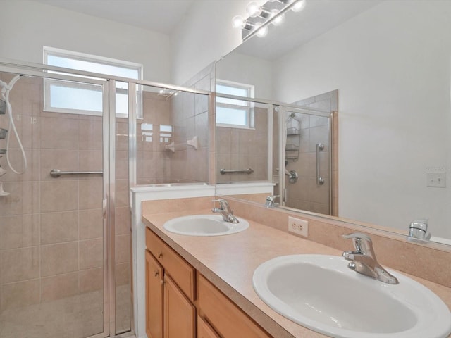 bathroom featuring vanity and an enclosed shower