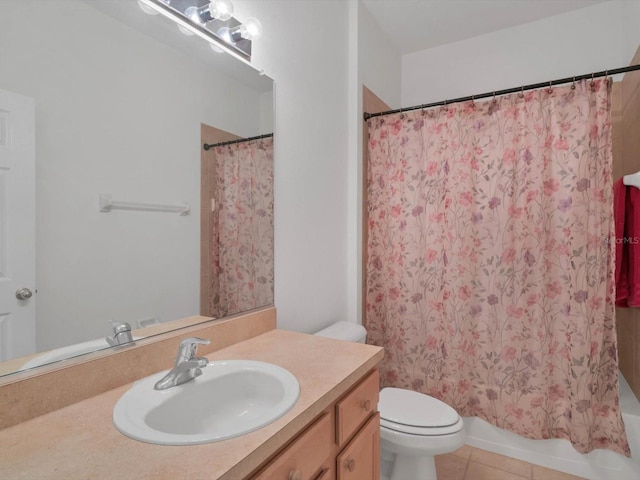 full bathroom featuring tile patterned flooring, vanity, toilet, and shower / bathtub combination with curtain