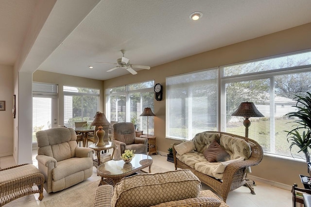 sunroom featuring ceiling fan