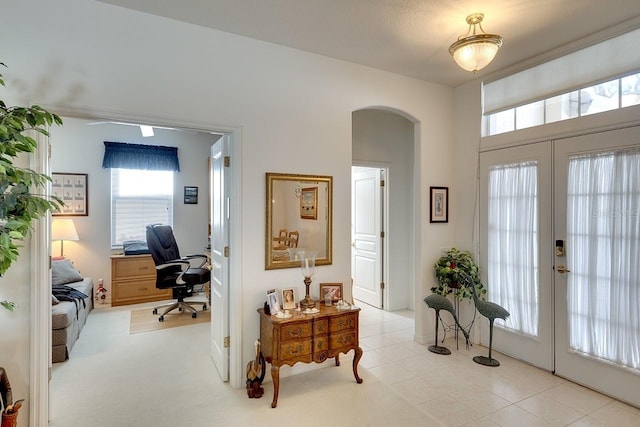 carpeted office with french doors