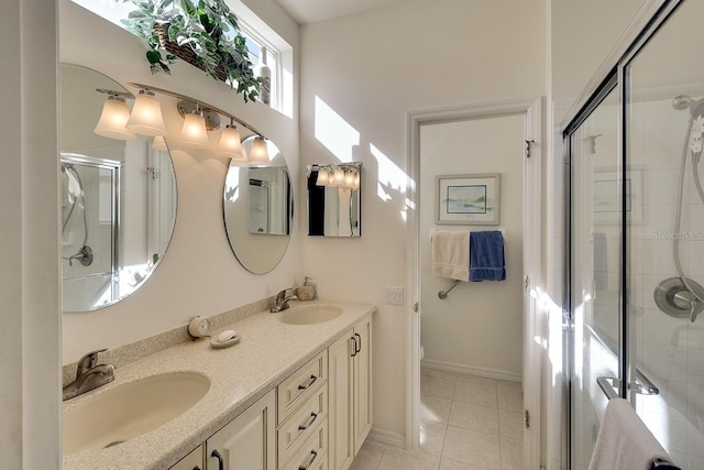 bathroom featuring tile patterned flooring, vanity, toilet, and a shower with door