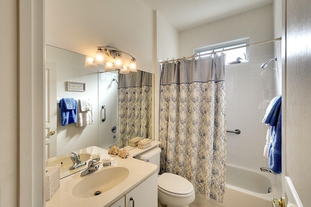 full bathroom with vanity, toilet, and shower / bath combo