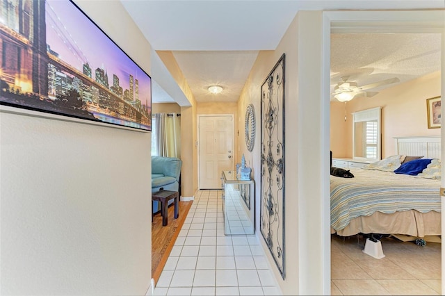 corridor with light tile patterned floors