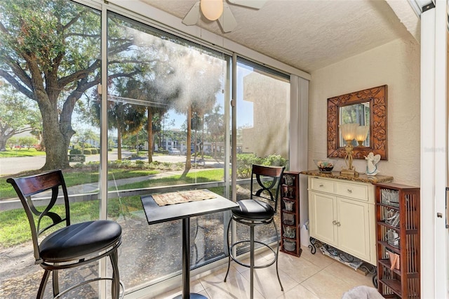 sunroom / solarium with ceiling fan